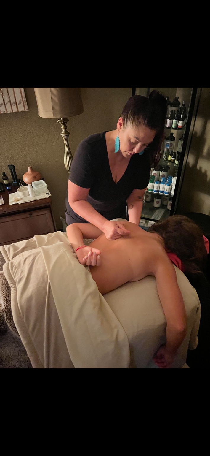 Natalie working with a client during a massage